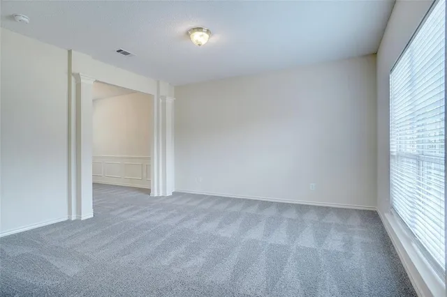 a view of an empty room and window