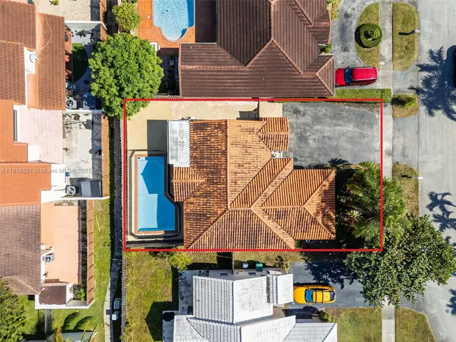 an aerial view of residential houses and outdoor space