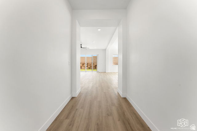 707 Spring Lily Drive St. George, UT 84790 - Photo 4 of 43 Wood-finish flooring extending through the hallway
