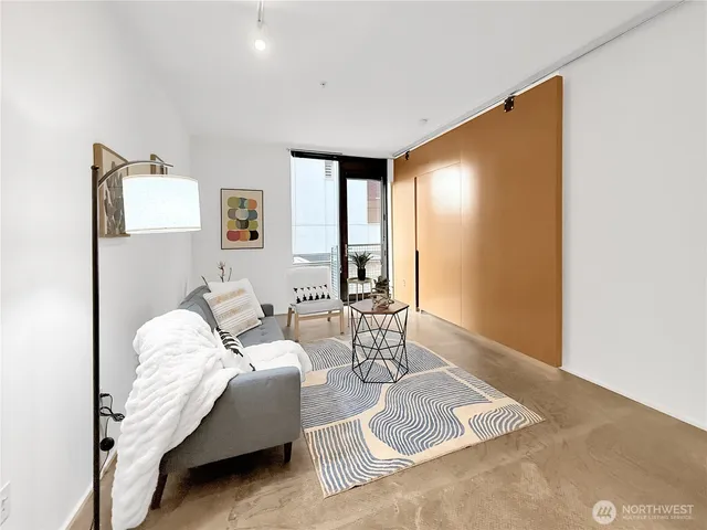 a living room with furniture and a table