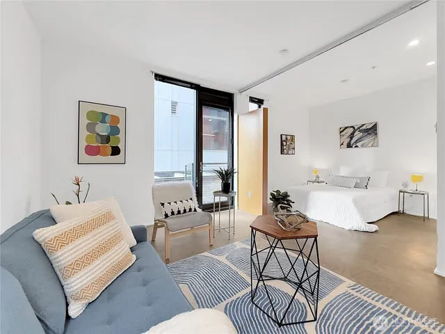 a dining room with furniture and wooden floor