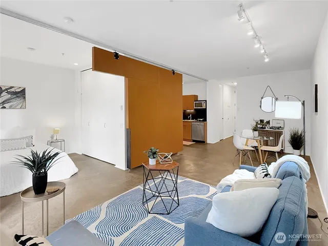 a bathroom with a bathtub sink and mirror