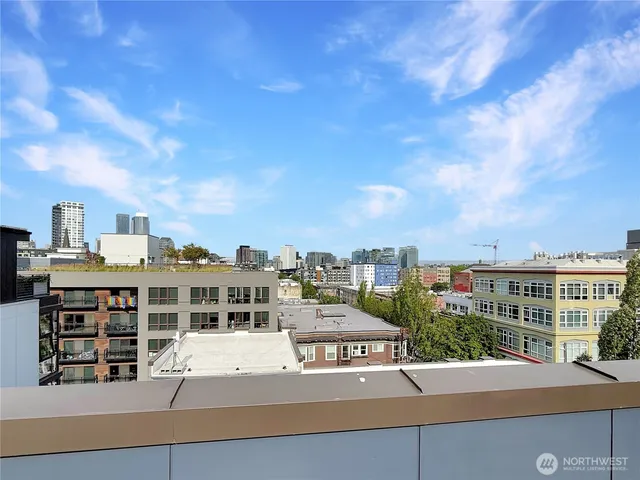 a view of a patio with dining table and chairs with a barbeque grill and plants