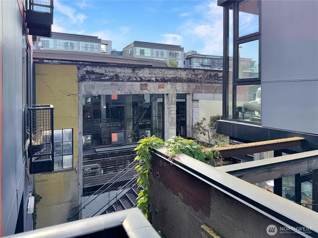 a living room with furniture potted plant and a lamp