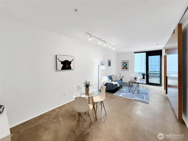 a living room with furniture and large window