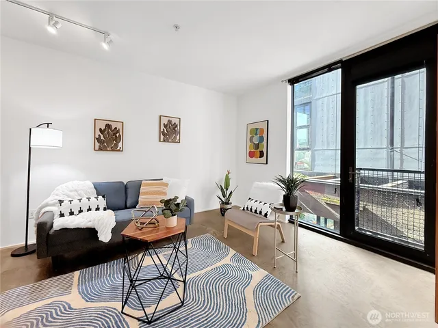 a living room with furniture and a garden