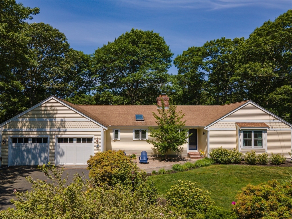 81 Crawford Road Barnstable, MA 02635 - Photo 2 of 42 a house with green field in front of it