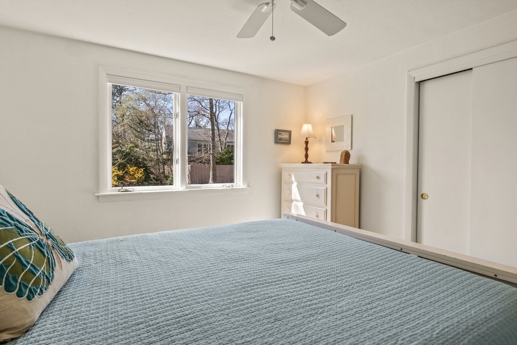 81 Crawford Road Barnstable, MA 02635 - Photo 28 of 42 a view of an empty room with a window and wooden floor