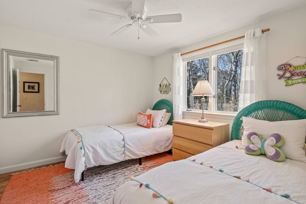 81 Crawford Road Barnstable, MA 02635 - Photo 31 of 42 a bedroom with two beds and a large window