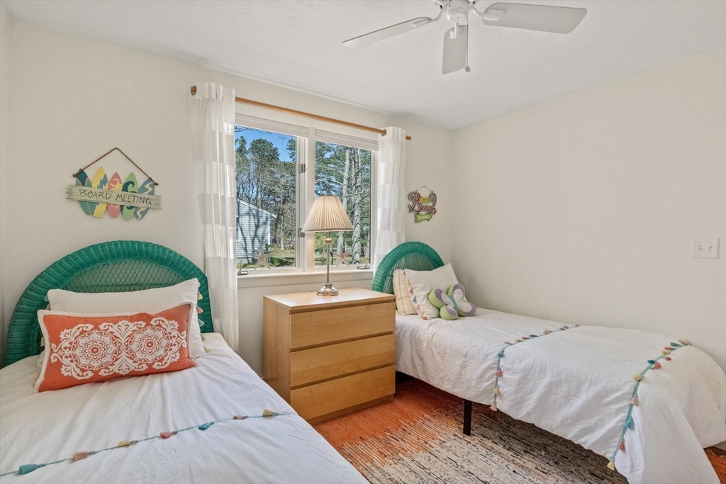 81 Crawford Road Barnstable, MA 02635 - Photo 32 of 42 a bedroom with a large bed and a window