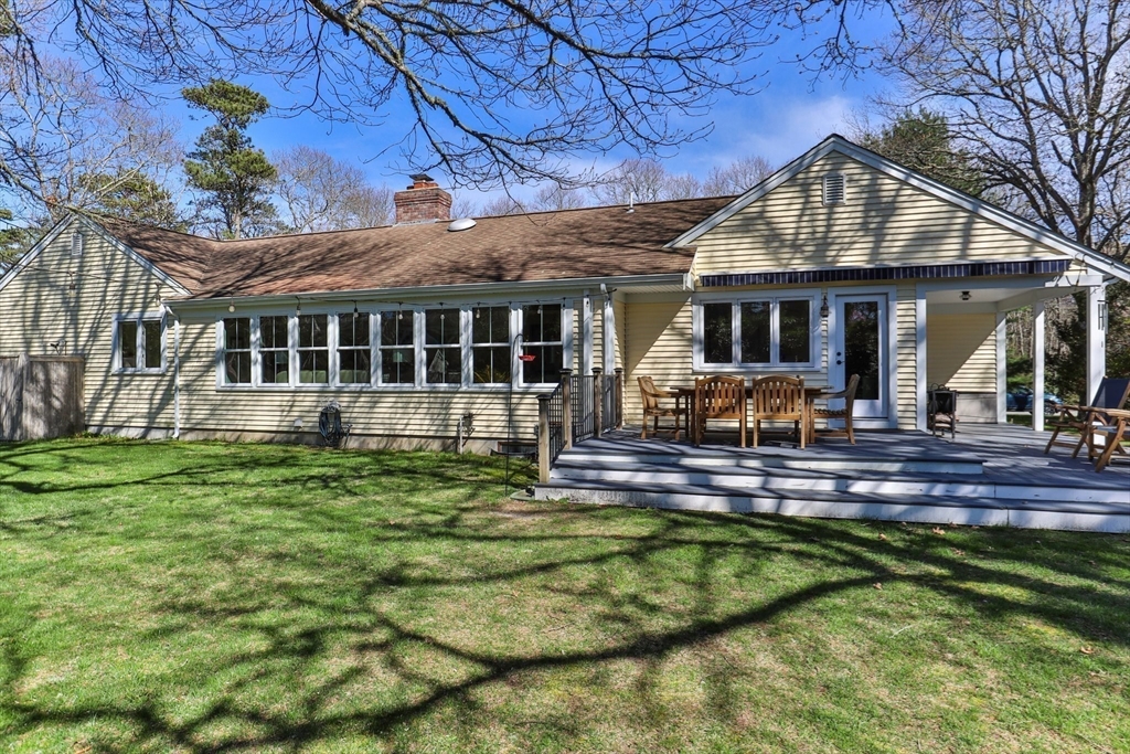 81 Crawford Road Barnstable, MA 02635 - Photo 4 of 42 a view of a house with a yard balcony and sitting area