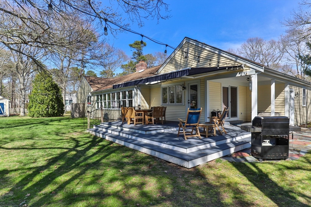 81 Crawford Road Barnstable, MA 02635 - Photo 42 of 42 a view of a house with backyard porch and sitting area
