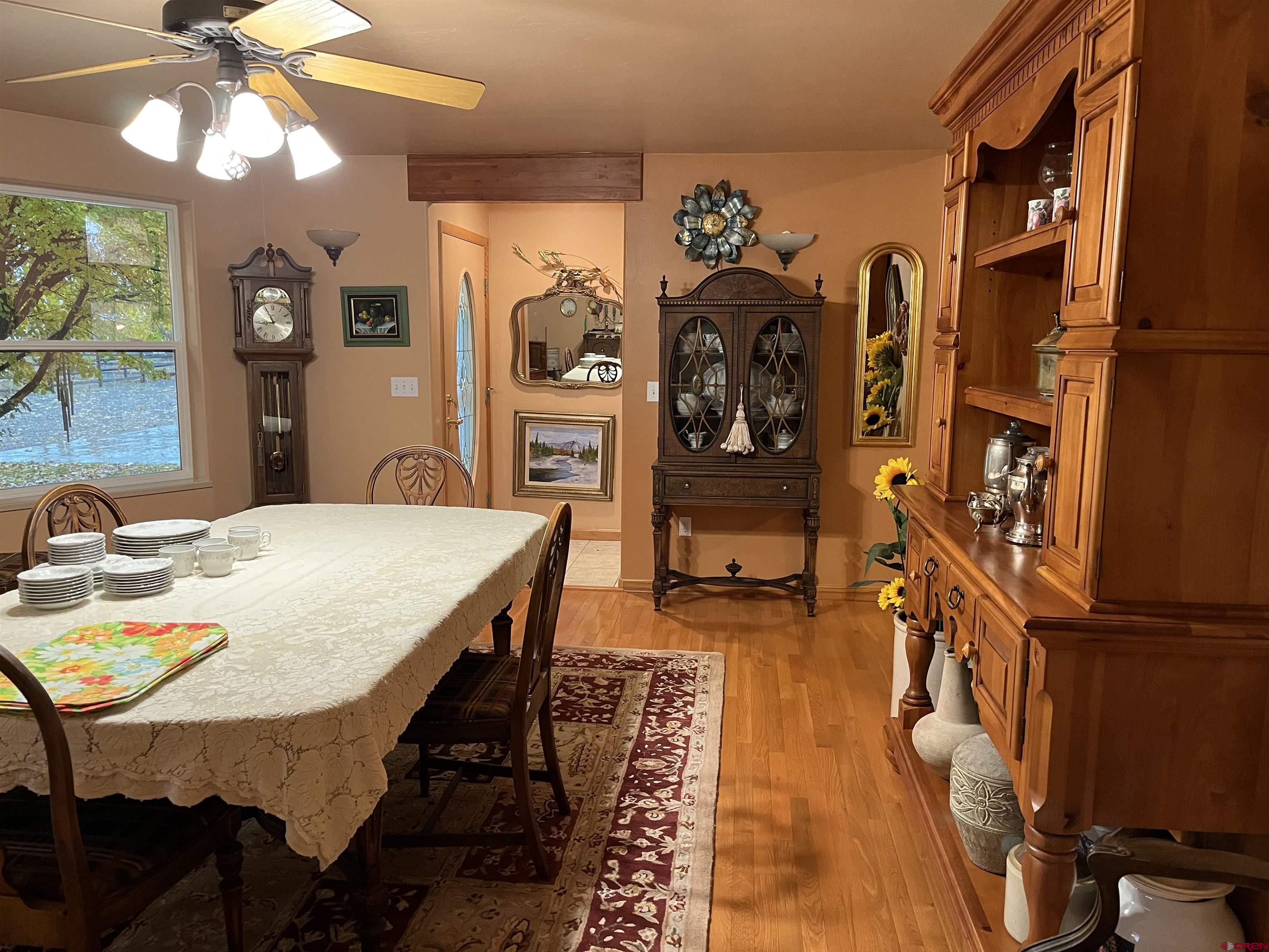 487 1775th Court Delta, CO 81416 - Photo 11 of 35 a view of a dining room with furniture and chandelier