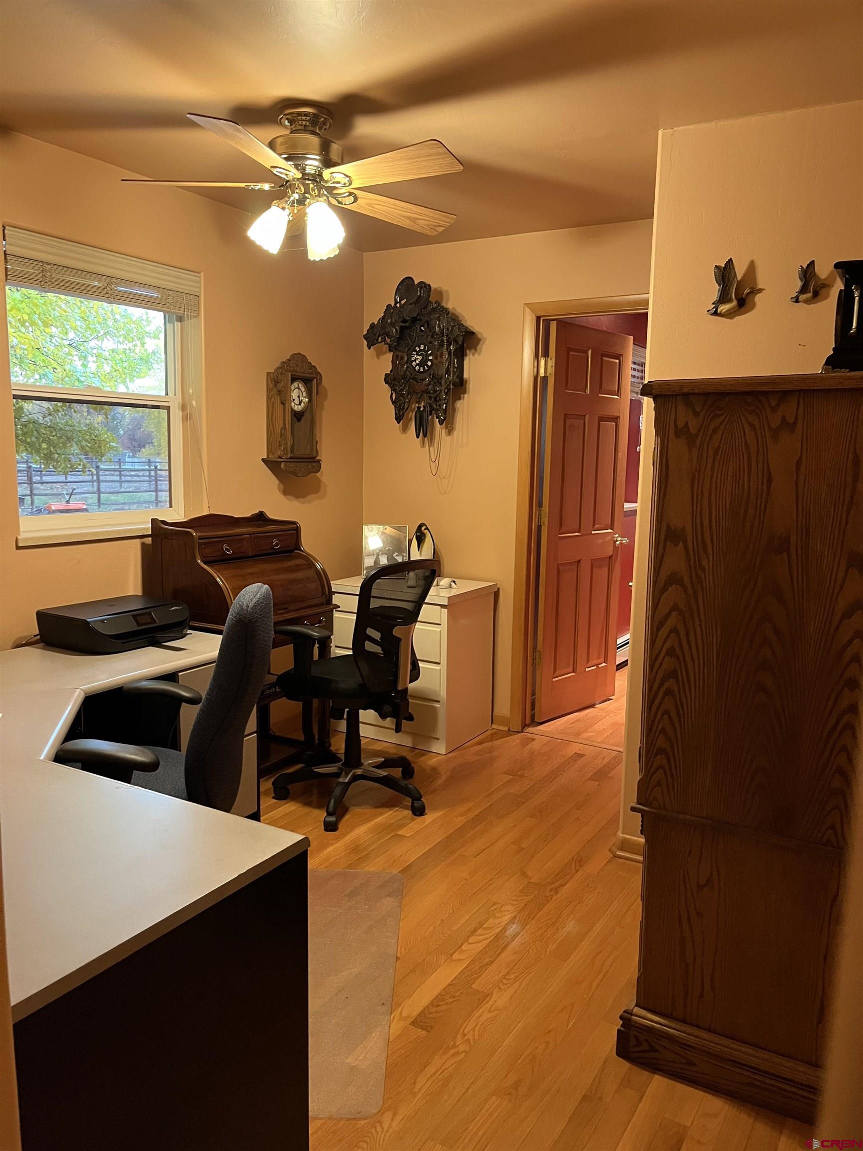 487 1775th Court Delta, CO 81416 - Photo 12 of 35 a living room with furniture and a window