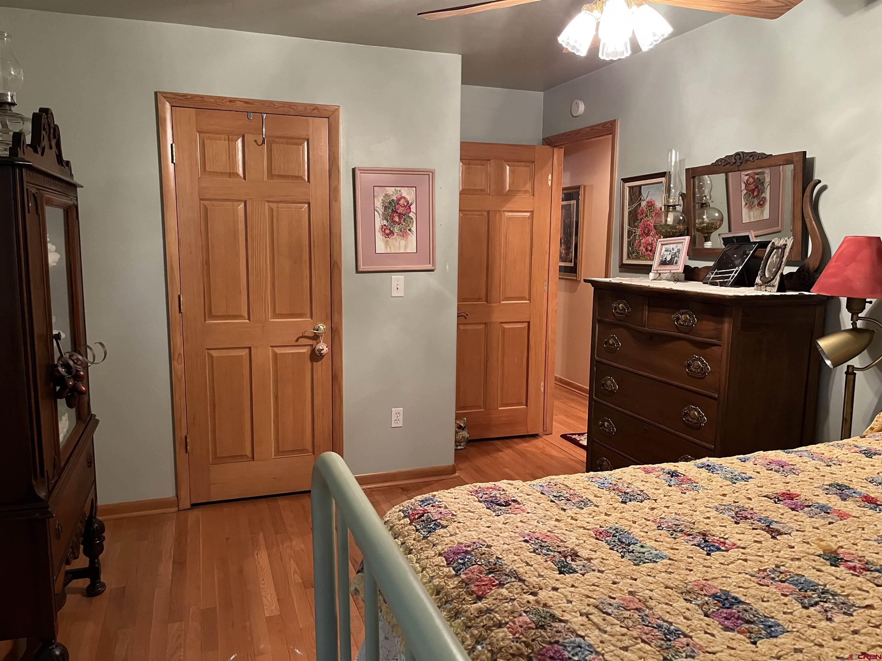 487 1775th Court Delta, CO 81416 - Photo 20 of 35 a bedroom with a bed and a dresser
