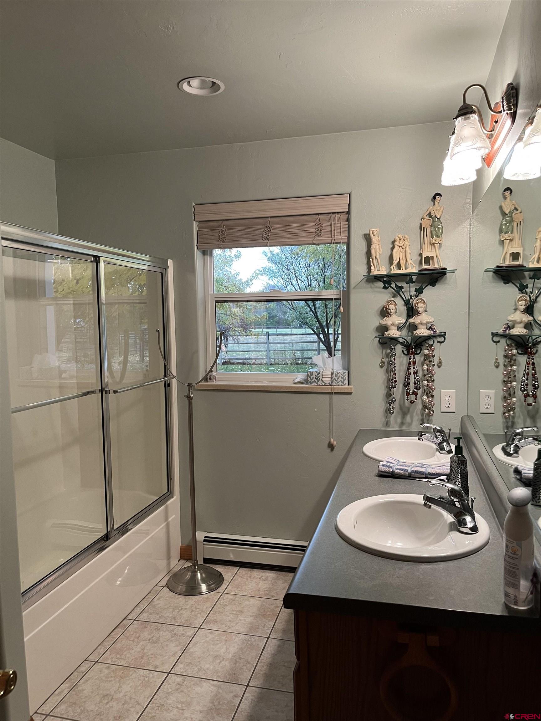 487 1775th Court Delta, CO 81416 - Photo 22 of 35 a bathroom with a sink and a mirror