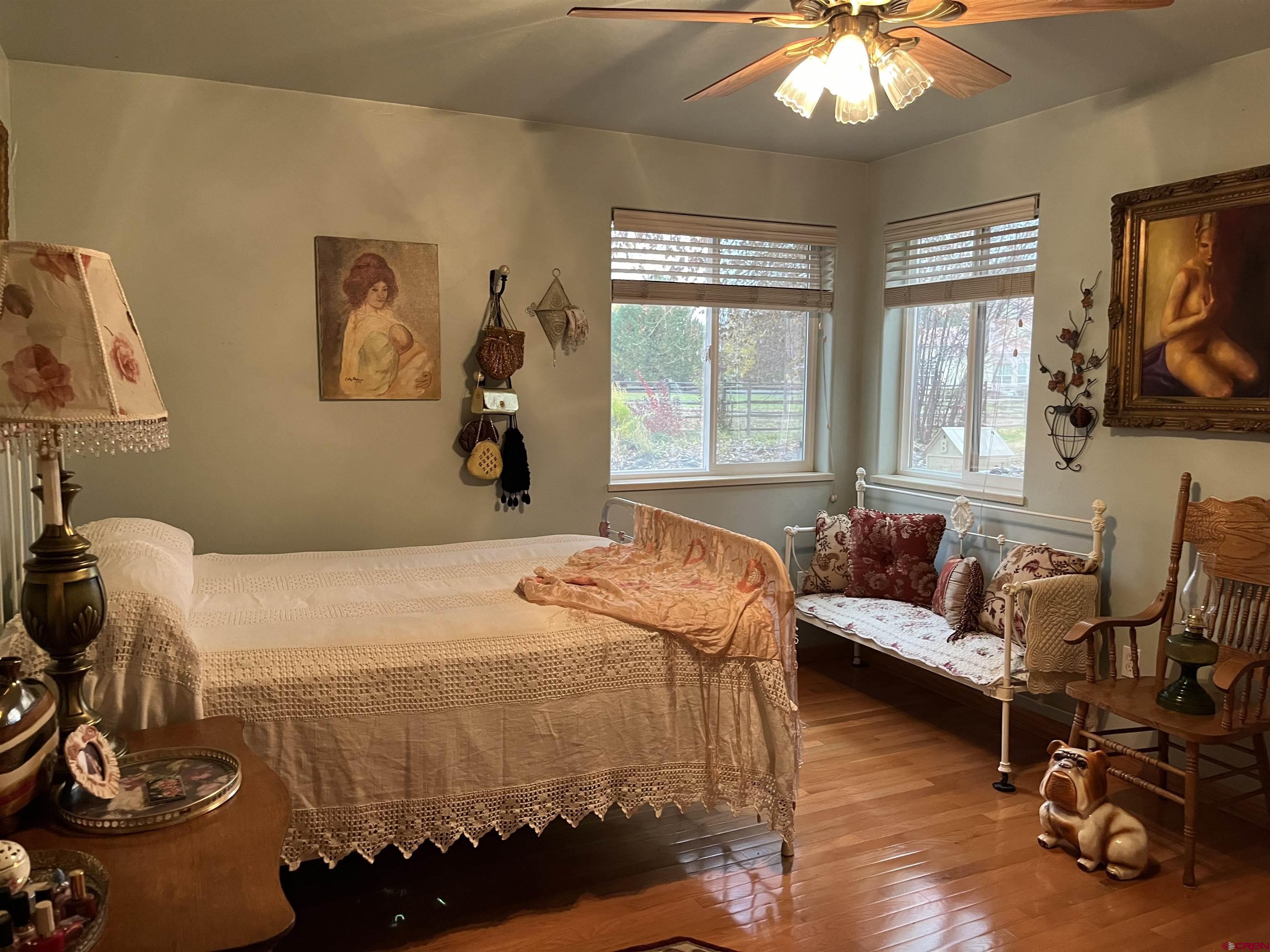 487 1775th Court Delta, CO 81416 - Photo 24 of 35 a bedroom with a bed and wooden floor