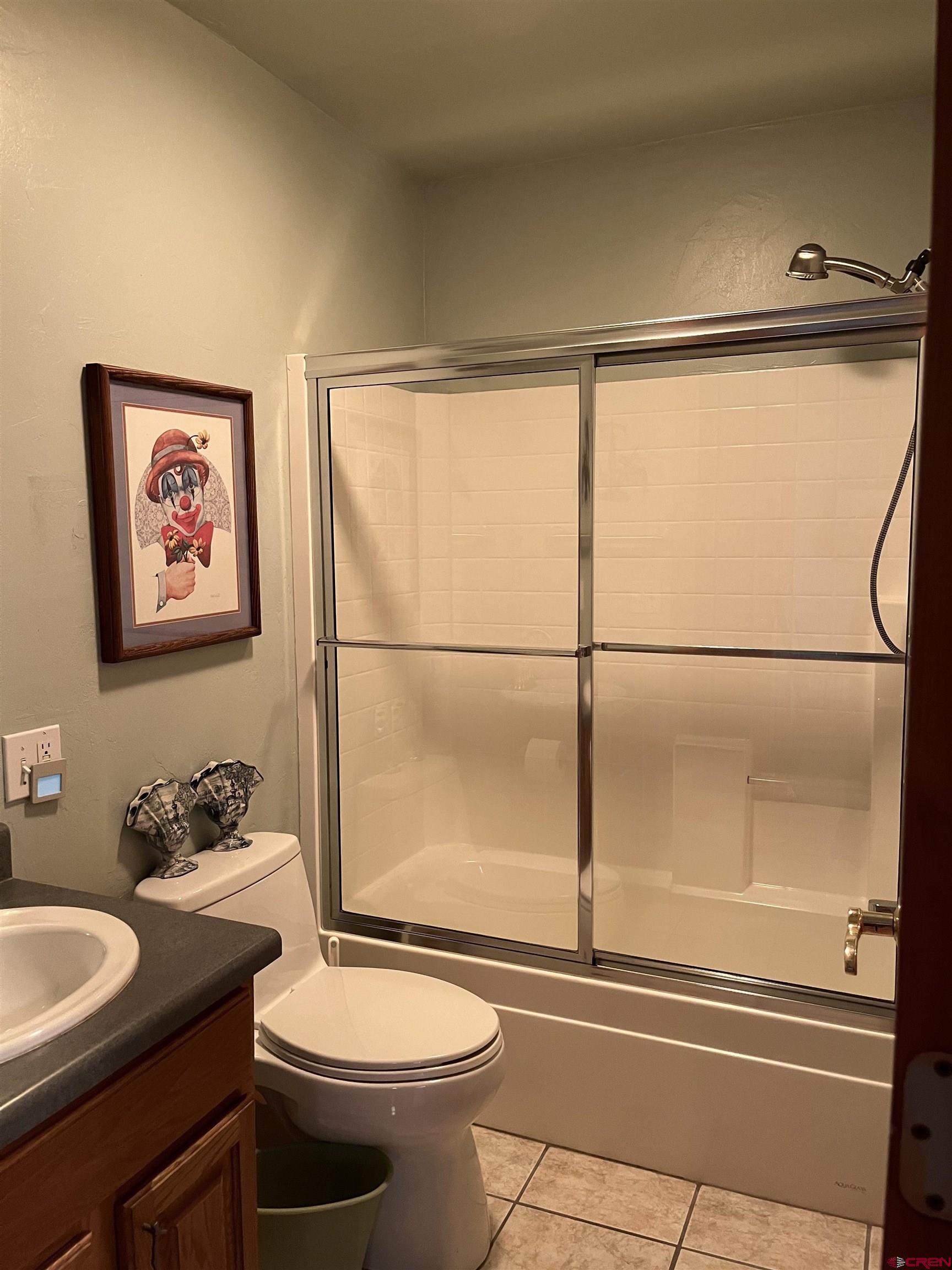 487 1775th Court Delta, CO 81416 - Photo 27 of 35 a bathroom with a granite countertop sink mirror vanity and toilet