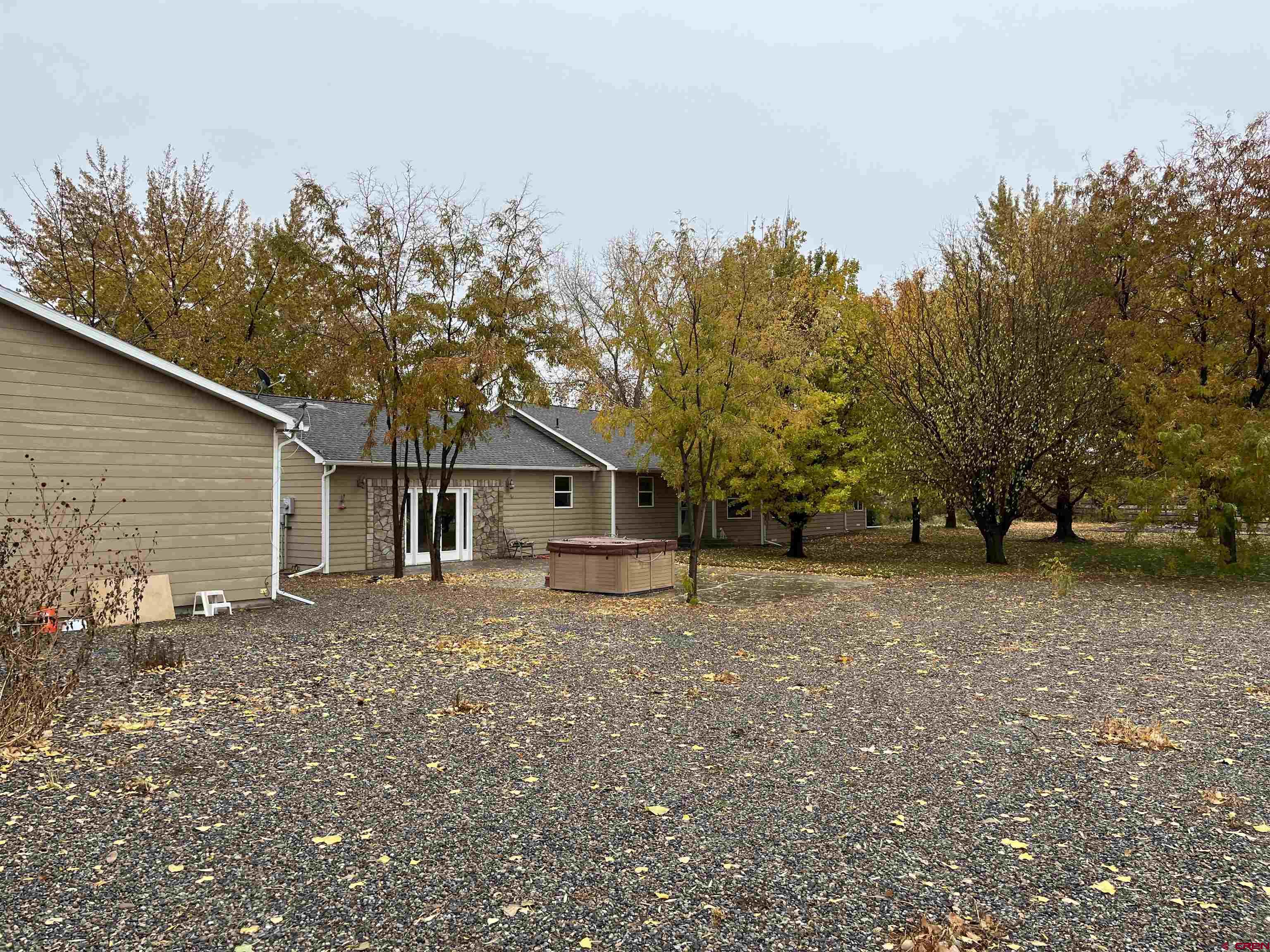 487 1775th Court Delta, CO 81416 - Photo 29 of 35 a house with trees in front of it
