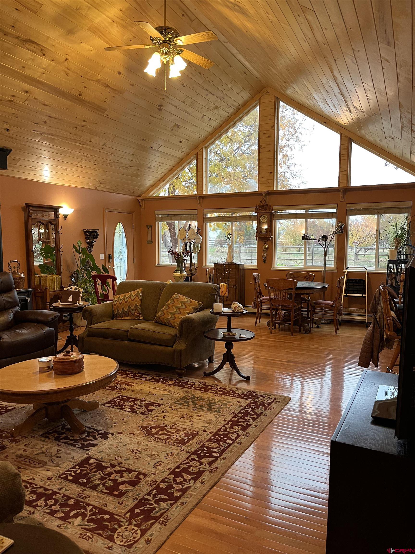 487 1775th Court Delta, CO 81416 - Photo 4 of 35 a living room with furniture large window and wooden floor