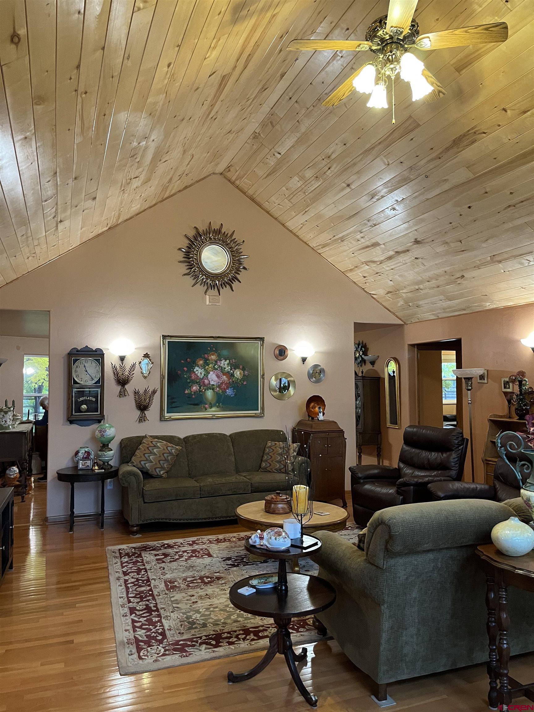 487 1775th Court Delta, CO 81416 - Photo 6 of 35 a living room with furniture and a flat screen tv