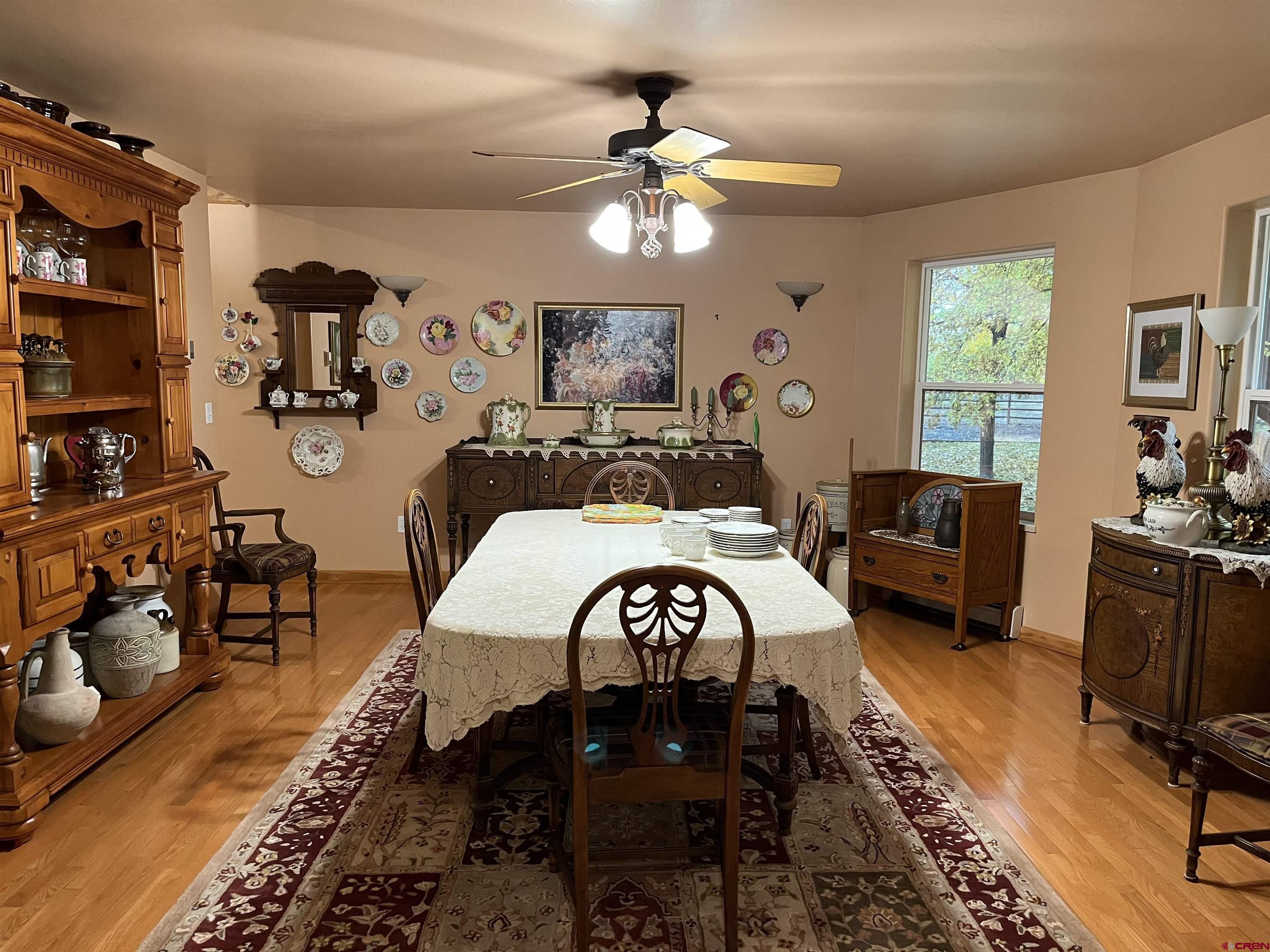 487 1775th Court Delta, CO 81416 - Photo 9 of 35 a view of a livingroom with furniture and a workspace