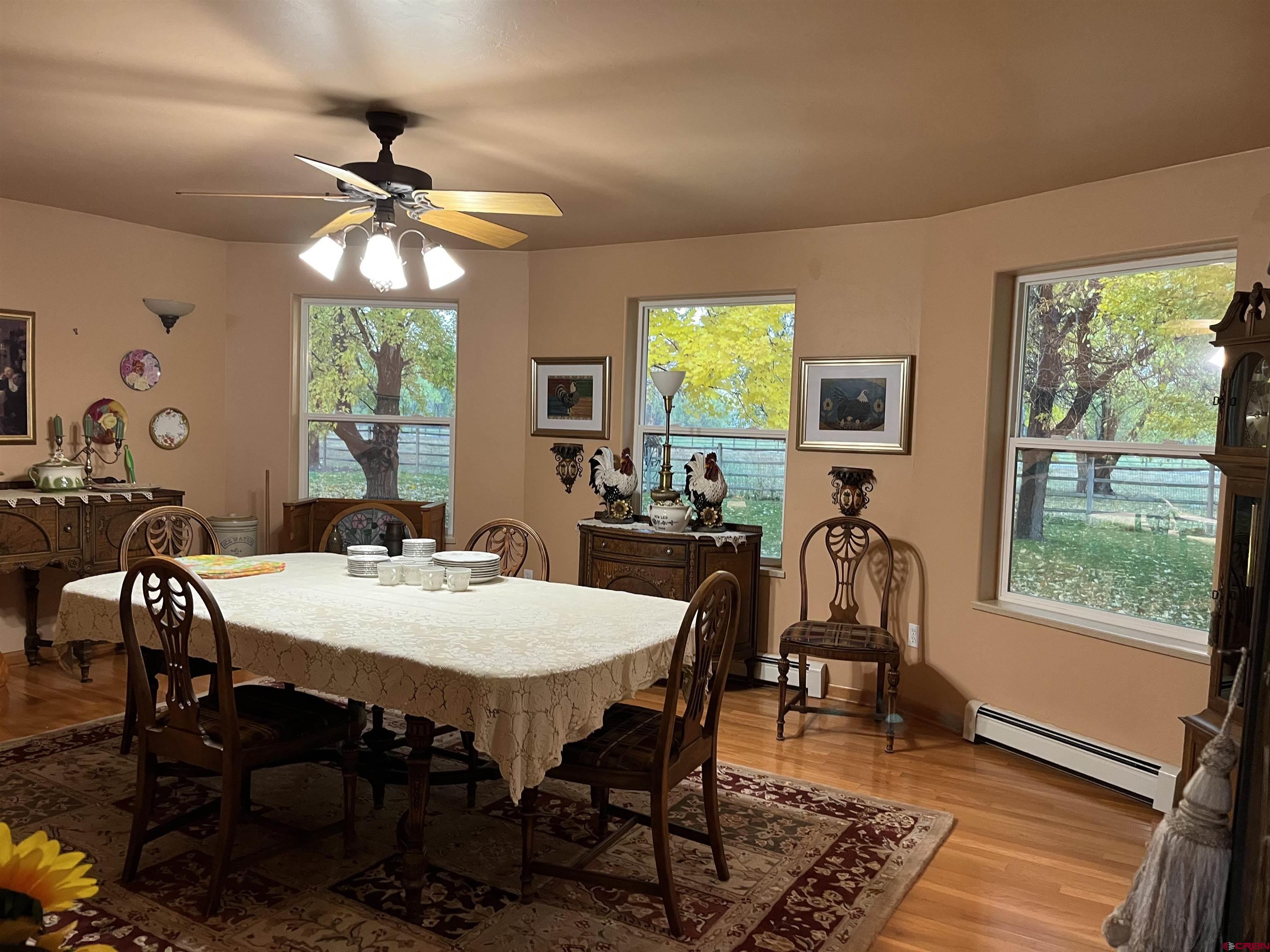 487 1775th Court Delta, CO 81416 - Photo 10 of 35 a view of a dining room with furniture window and outside view
