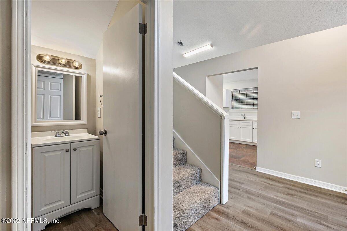 5452 Fort Caroline Road Jacksonville, FL 32277 - Photo 11 of 19 11-Powder Room and Stairs