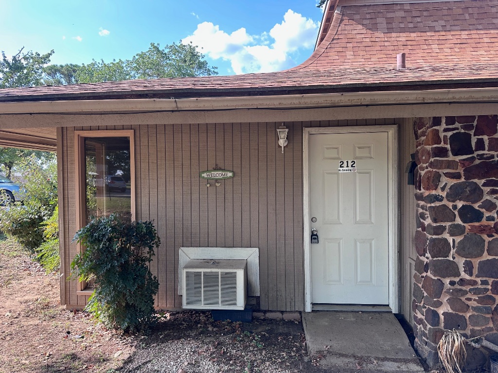 a couple of potted plants in front of door