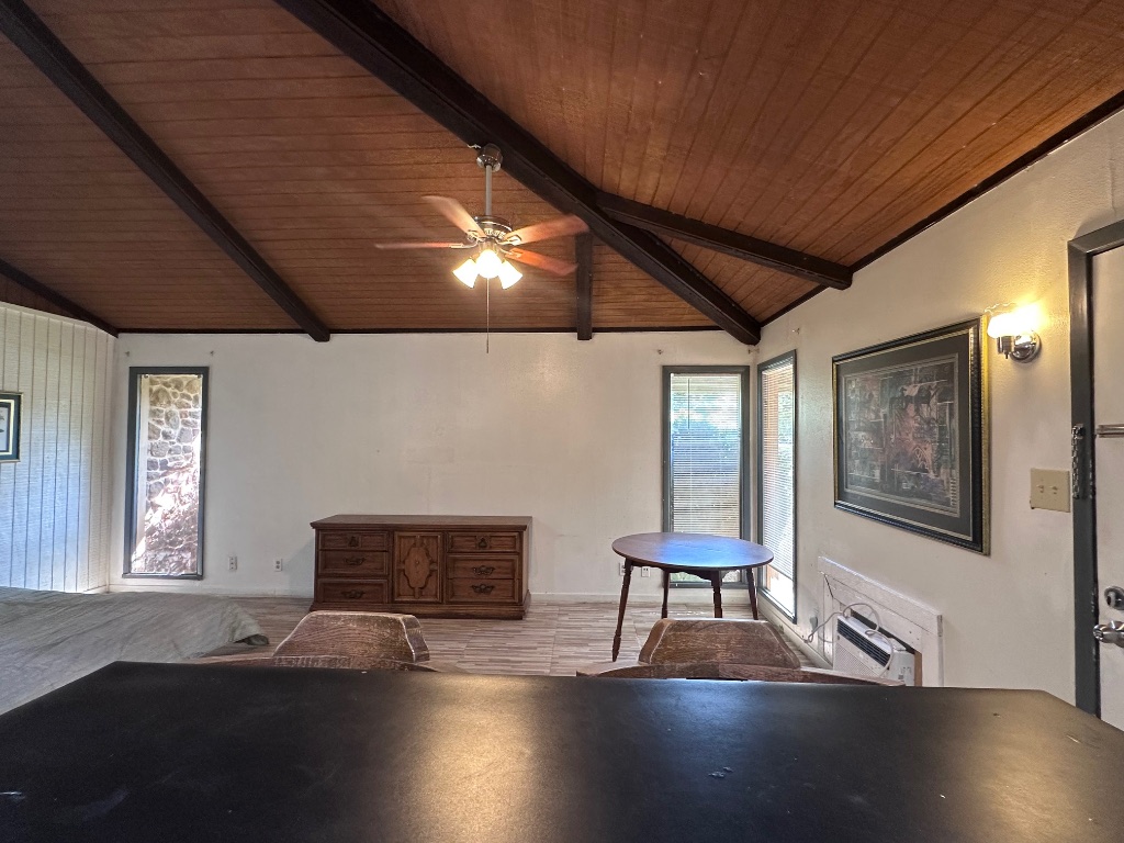 126 Conference Drive, Unit 212 Bastrop, TX 78602 - Photo 2 of 9 a room with furniture and a window