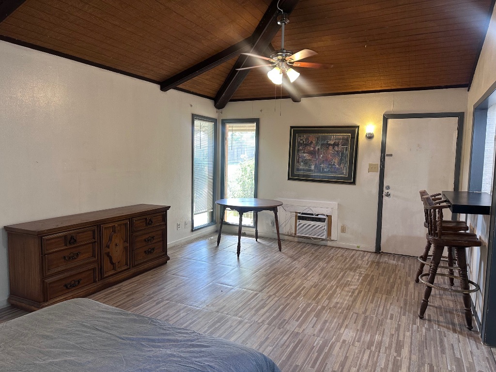 126 Conference Drive, Unit 212 Bastrop, TX 78602 - Photo 5 of 9 a living room with furniture and a wooden floor