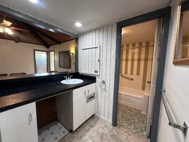 a bathroom with a sink and a mirror