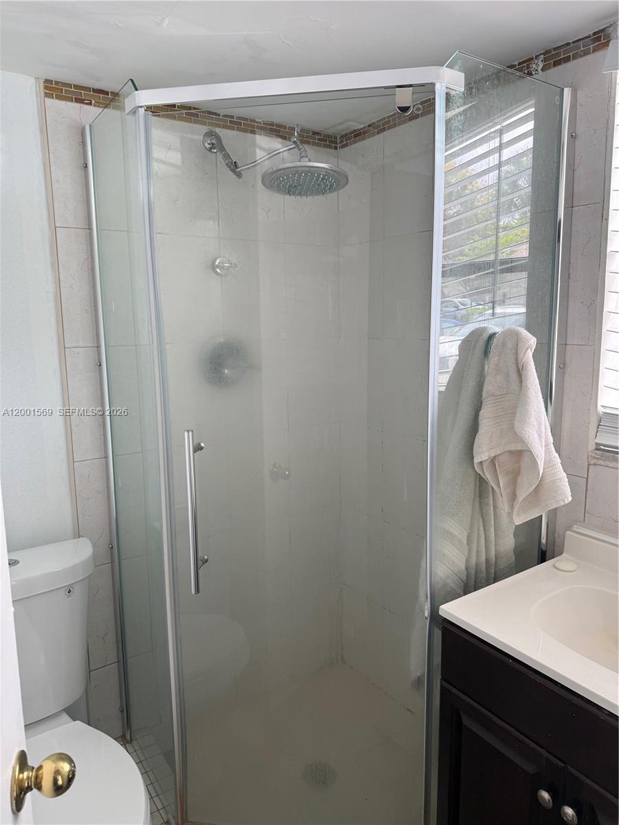 7200 Northwest 2nd Avenue, Unit 160 Boca Raton, FL 33487 - Photo 25 of 40 a bathroom with a sink toilet and shower