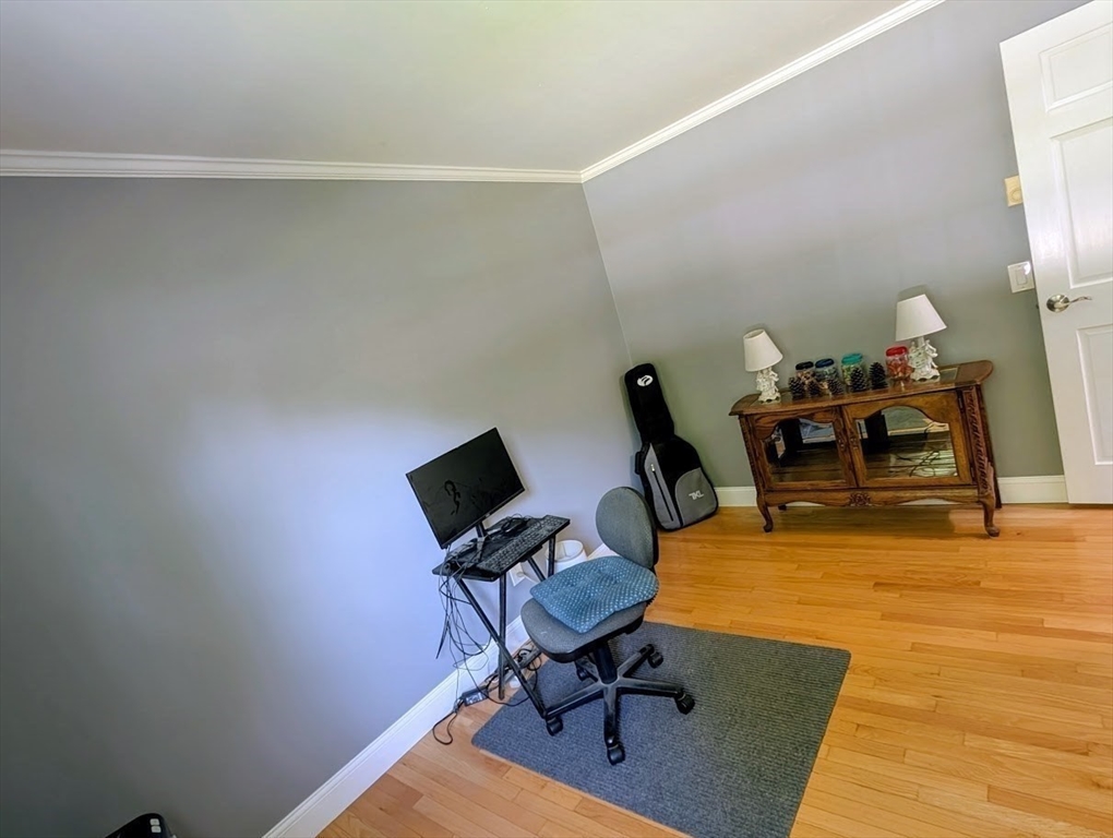 10 Harrington Road Charlton, MA 01507 - Photo 15 of 36 a view of a workspace with furniture and a bathroom