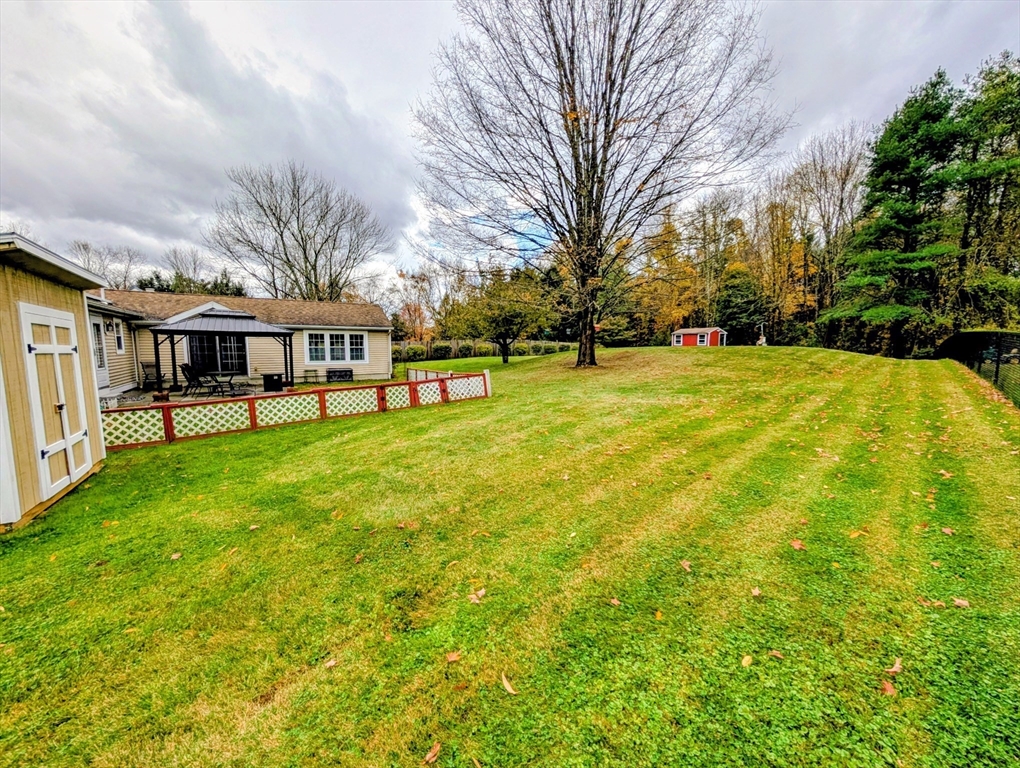 10 Harrington Road Charlton, MA 01507 - Photo 31 of 36 a view of a house with a big yard and large trees