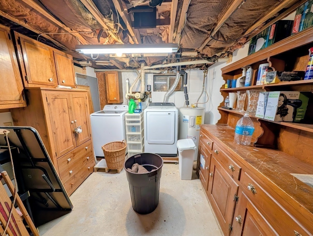 10 Harrington Road Charlton, MA 01507 - Photo 32 of 36 a room with furniture a rug and a bookshelf
