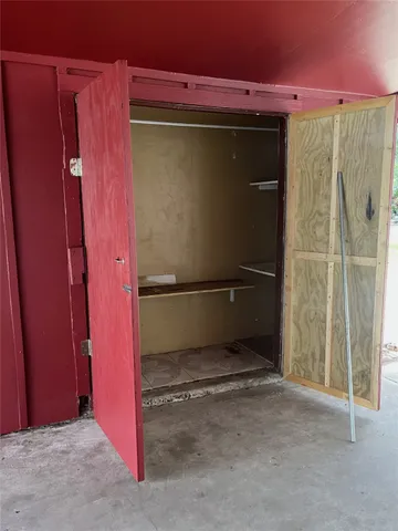 a view of a backyard with large trees and a large tree