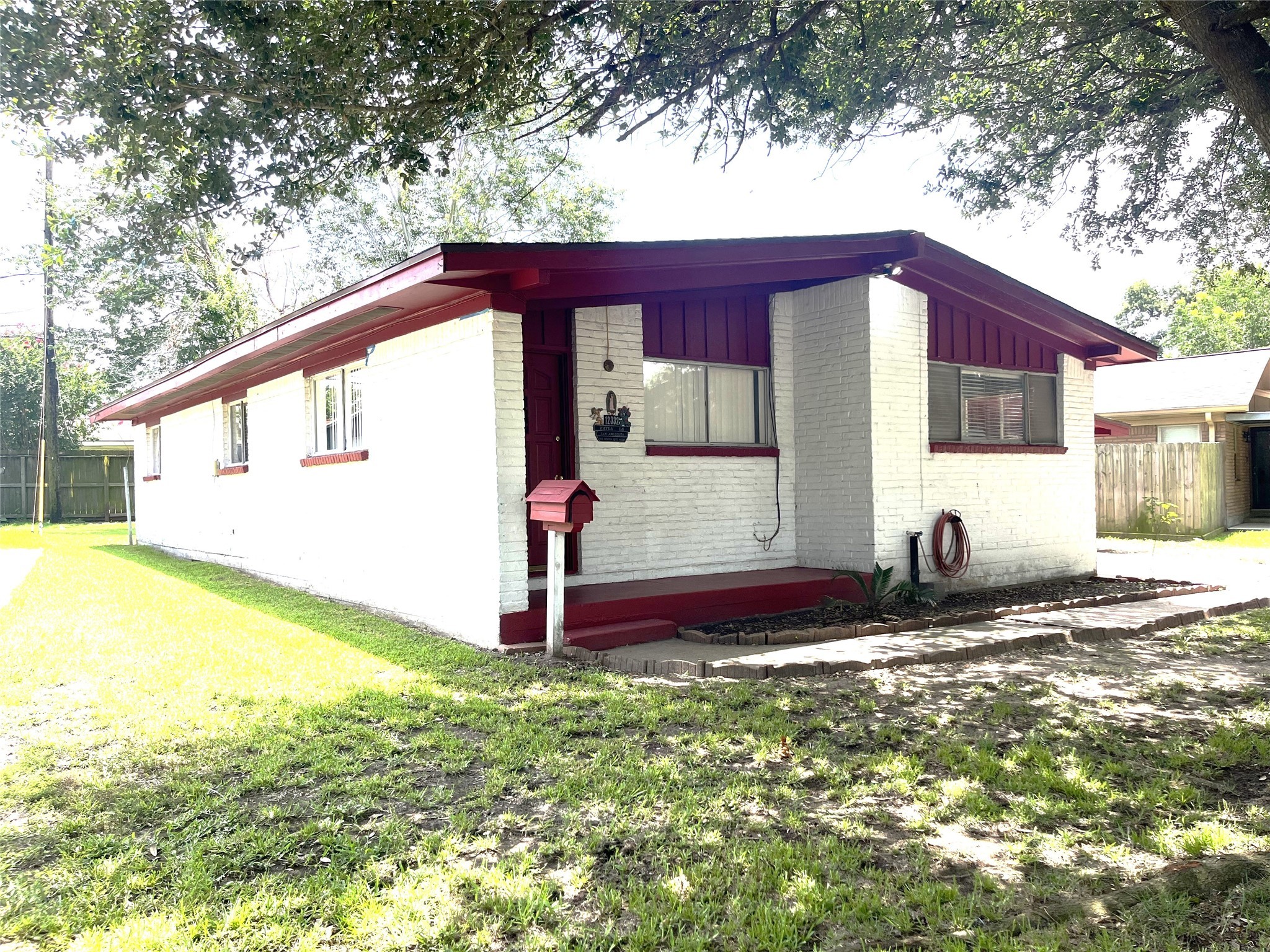 12332 Kayla Lane Houston, TX 77015 - Photo 2 of 15 a view of a small house with yard