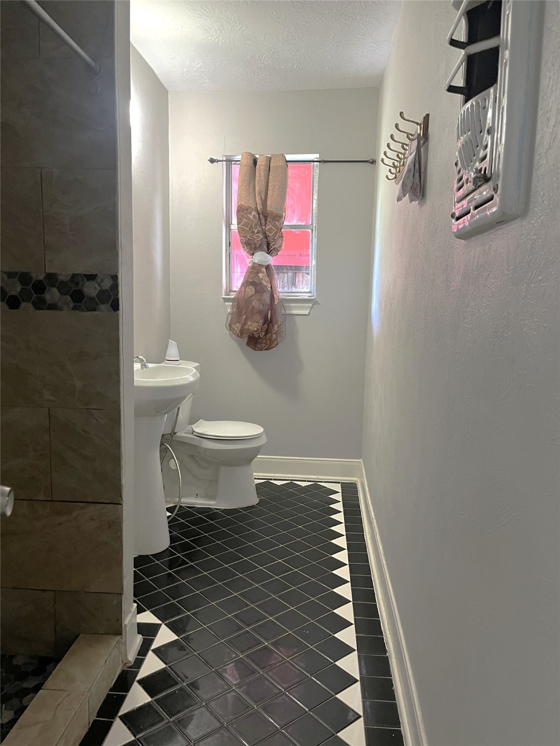 12332 Kayla Lane Houston, TX 77015 - Photo 8 of 15 a bathroom with a sink toilet and shower