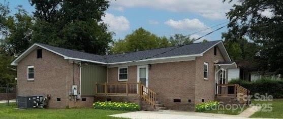 436 Clinton Avenue Lancaster, SC 29720 - Photo 2 of 11 a front view of a house with garden