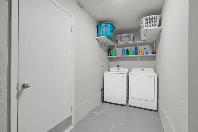 a bedroom with furniture and a flat screen tv