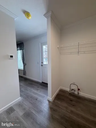 a view of a storage & utility room with a sink