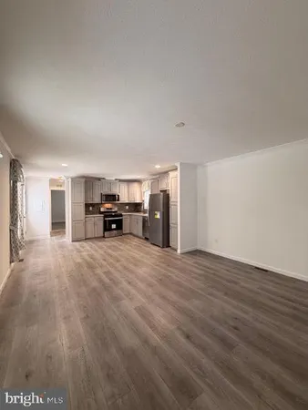 a view of a livingroom with furniture and furniture