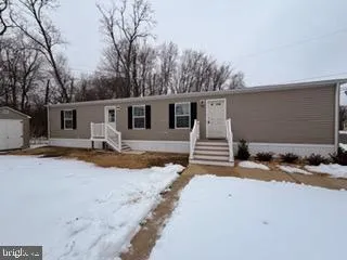 a view of a house with snow in snow