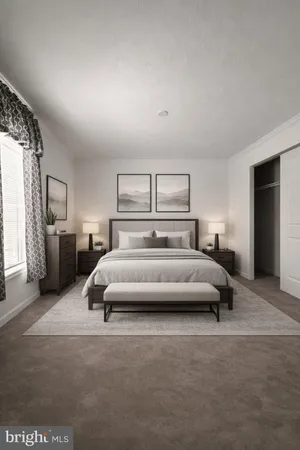 a bedroom with a large bed and a couch