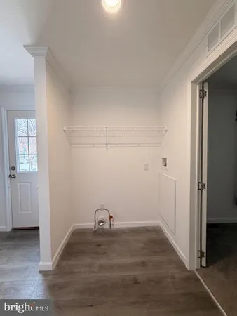 a view of a livingroom with wooden floor