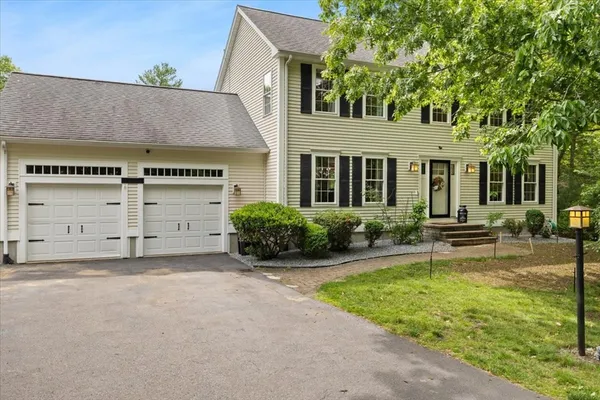 front view of a house with a yard
