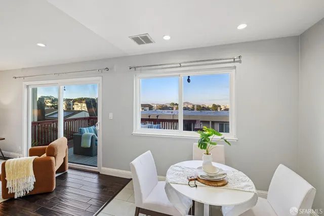 a kitchen with a refrigerator and a sink