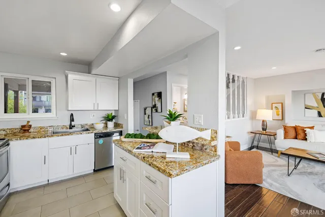 a bathroom with a sink mirror and vanity