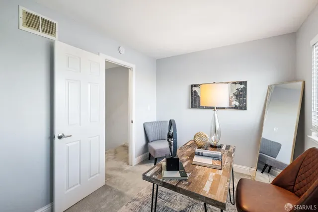 a bedroom with a bed and a curtain